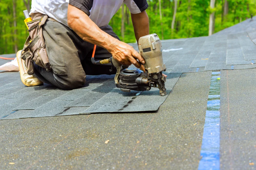 Roofing contractor using professional tools for roof installation in New Castle County, Delaware